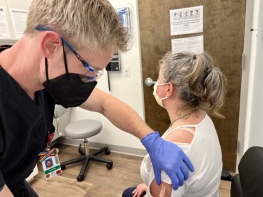 Dr. Eric Lella administering a shot