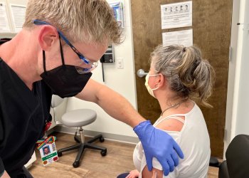 Dr. Eric Lella administering a shot