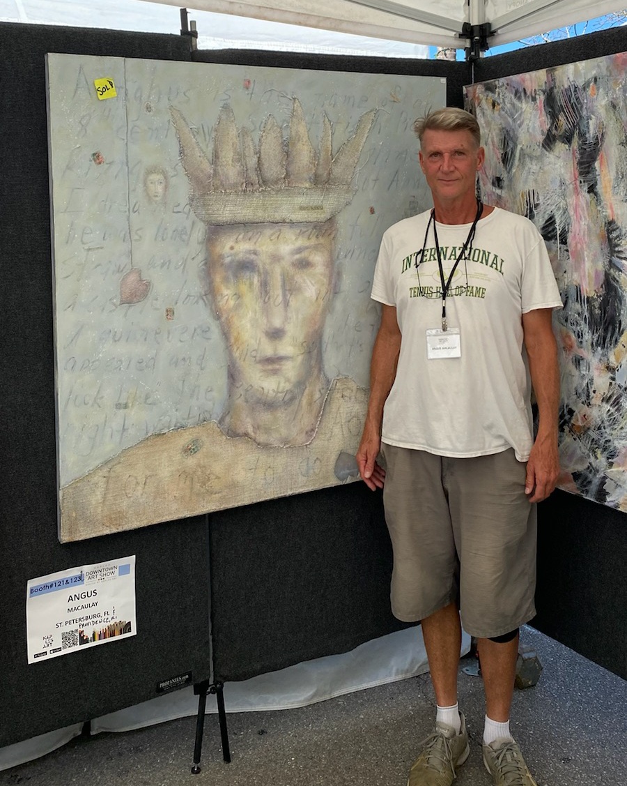 Southampton Art Festival creator Angus Macaulay next to his expressionistic self portrait