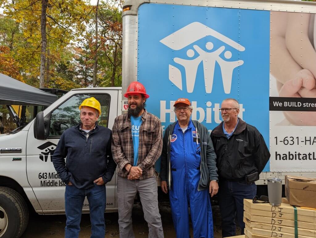 From left, Louis DeBrino of PSEG LI, Matt Charron, Habitat for Humanity CEO Lee Silberman and Ray Harden of Ben Krupinski Builder