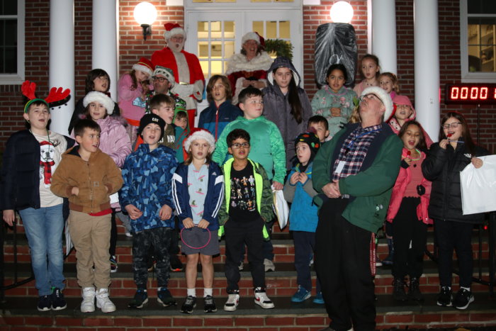 4th and 5th grade children sing Christmas carols before the tree lighting