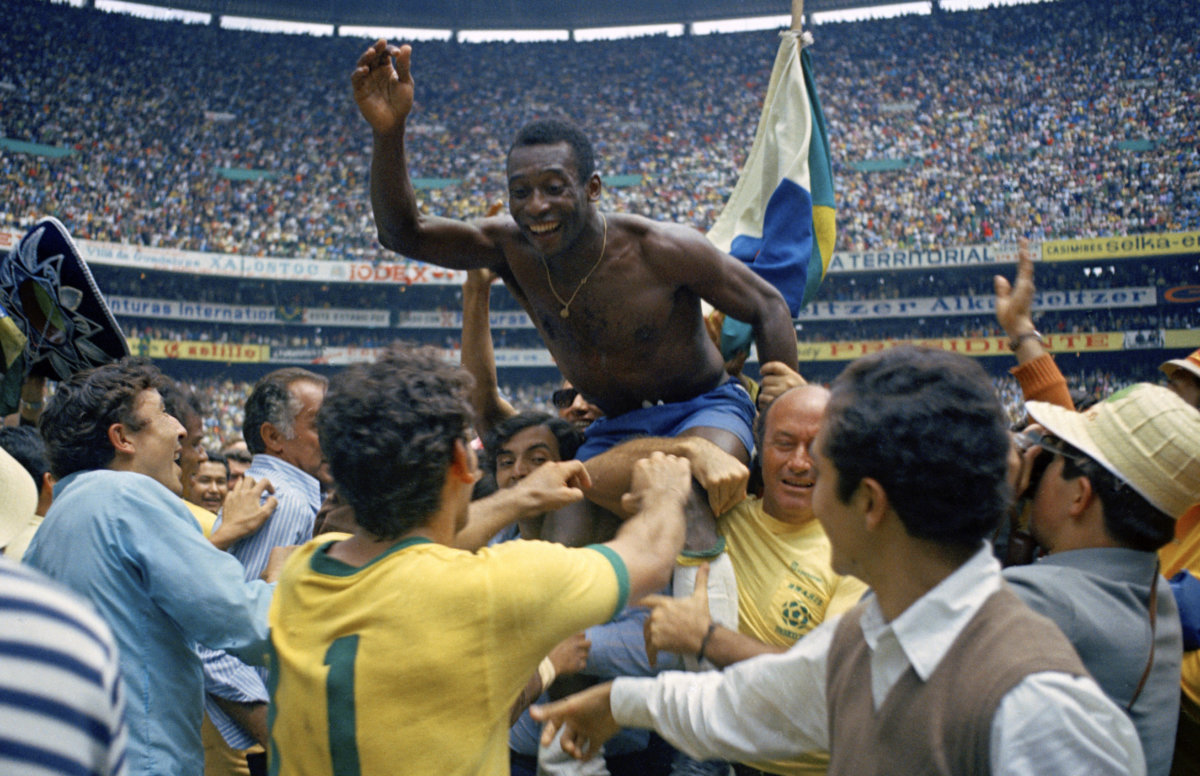 Pelé is hoisted on the shoulders of his teammates after Brazil won the World Cup final against Italy, 4-1, in Mexico City's Estadio Azteca, June 21, 1970