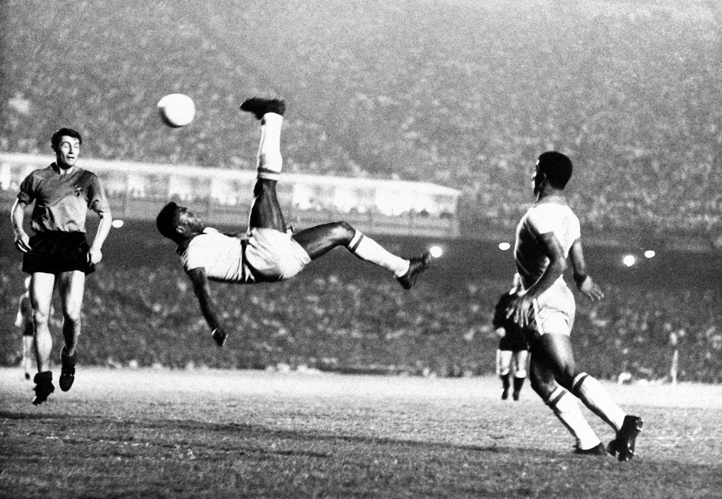 Pelé bicycle kicks a ball during a game at unknown location in September 1968