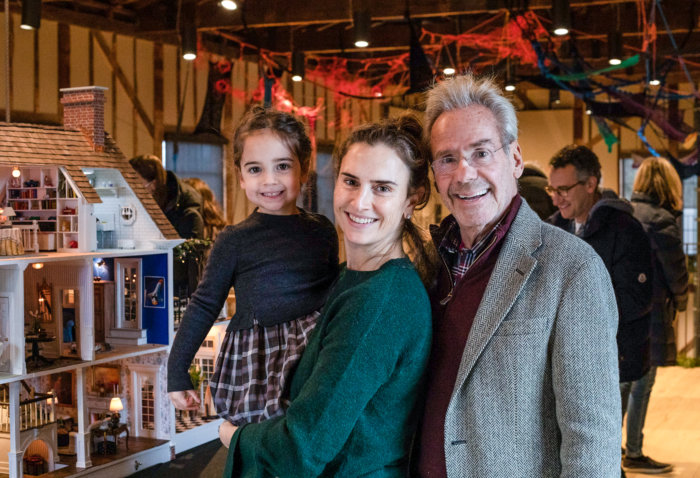 Barrett Green, Lindsey Green, and Keith Green with Barrett's Dollhouse at The Church Holiday Maker's Market