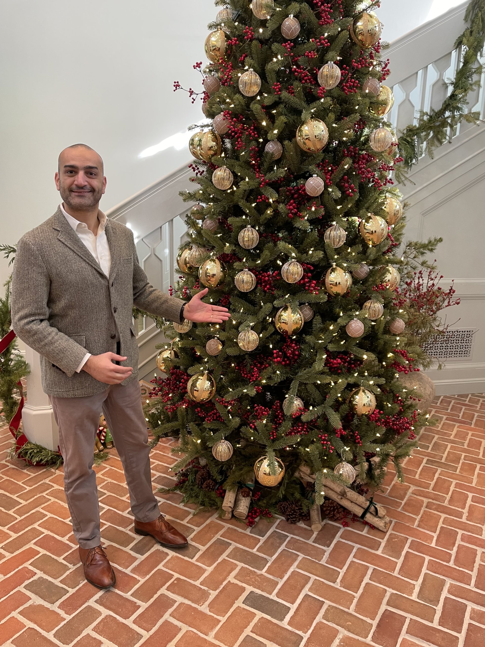 Canoe Place Inn & Cottages manager Mario Arakelian with Christmas tree