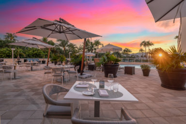 Dining by the pool at the Ambassador Hotel and Residences in Palm Beach