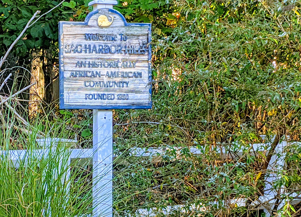 A sign noting the significance of Sag Harbor Hills, part of SANS