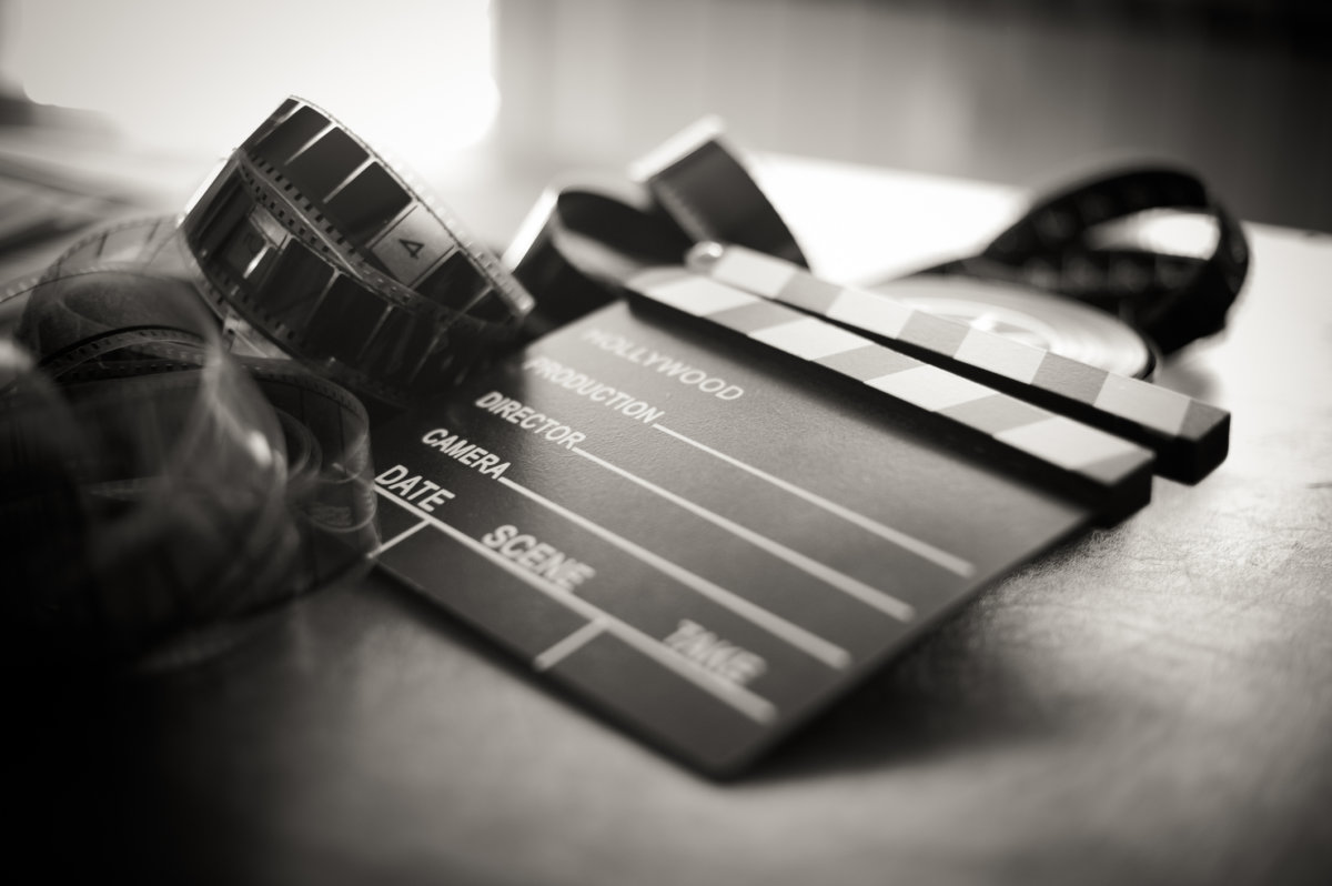 The Flesh Eaters Movie clapper board and filmstrip selective focus and vintage black and white