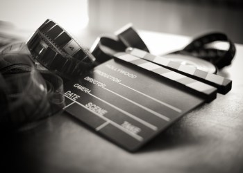 The Flesh Eaters Movie clapper board and filmstrip selective focus and vintage black and white