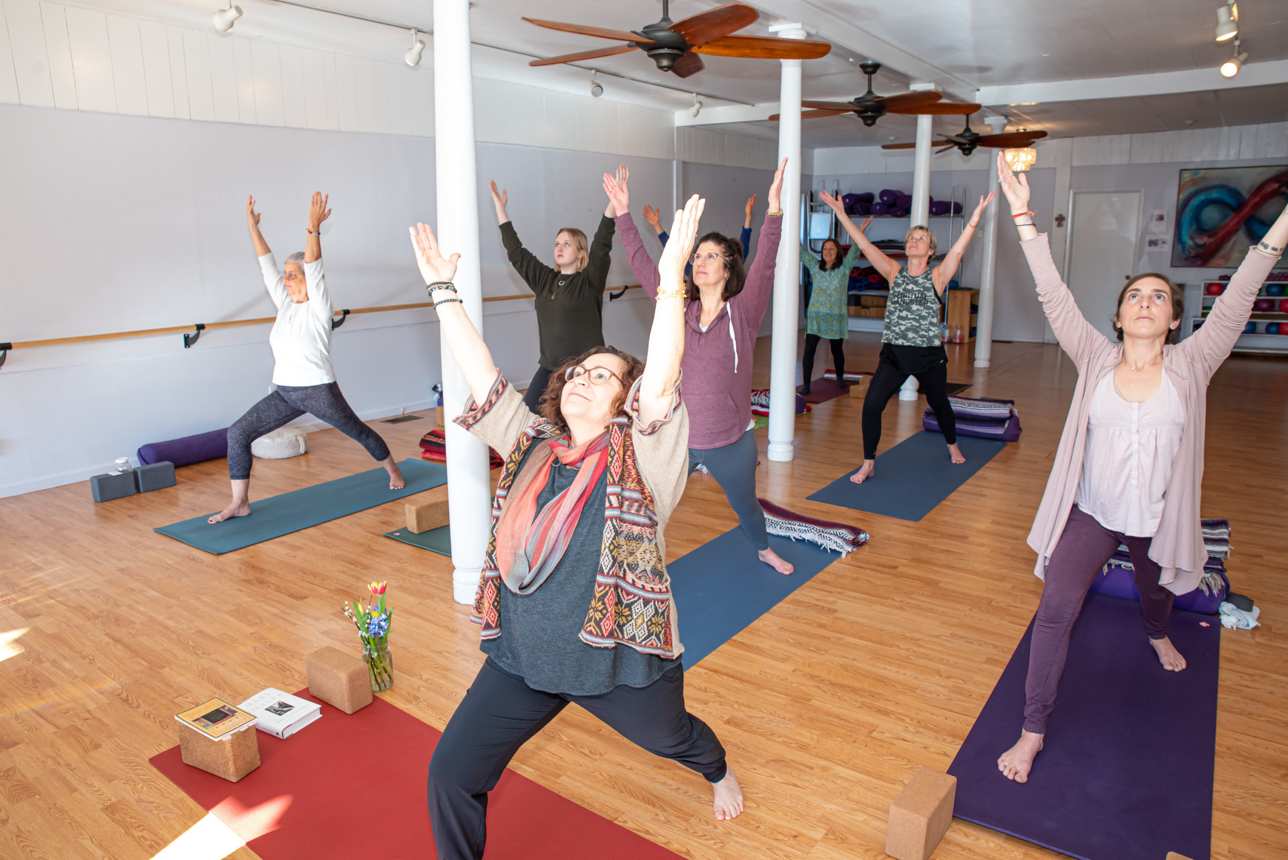 Paula DiDonato leading a yoga class at The Giving Room