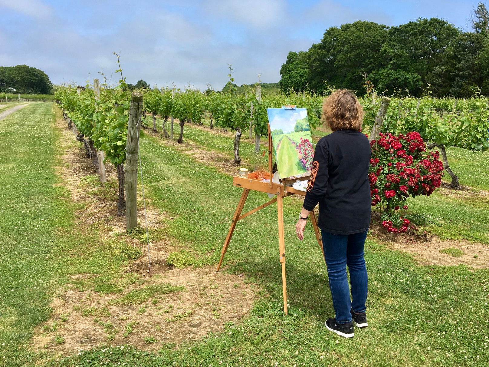 Patricia Feiler painting what would become the March 3, 2023 Dan's Papers North Fork cover at Borghese Vineyard