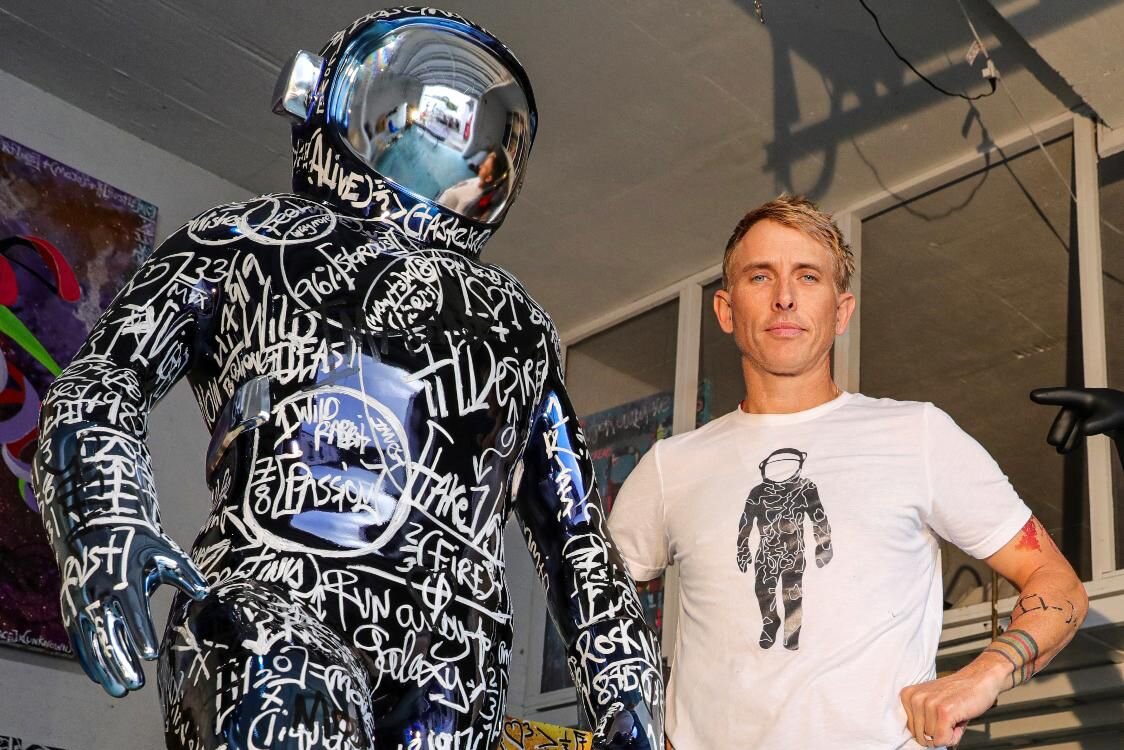 Brendan Murphy with one of his "Boonji Spaceman" sculptures