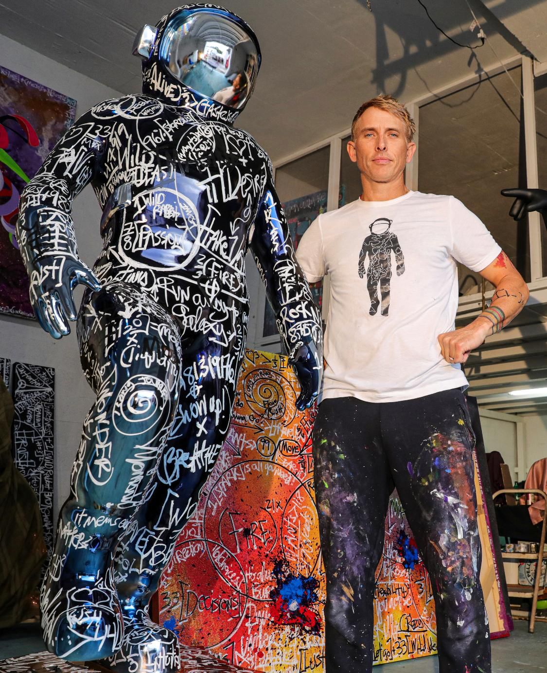 Brendan Murphy with one of his "Boonji Spaceman" sculptures