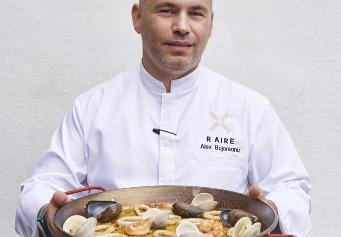 R.AIRE Chef Alex Bujoreanu with paella a plenty