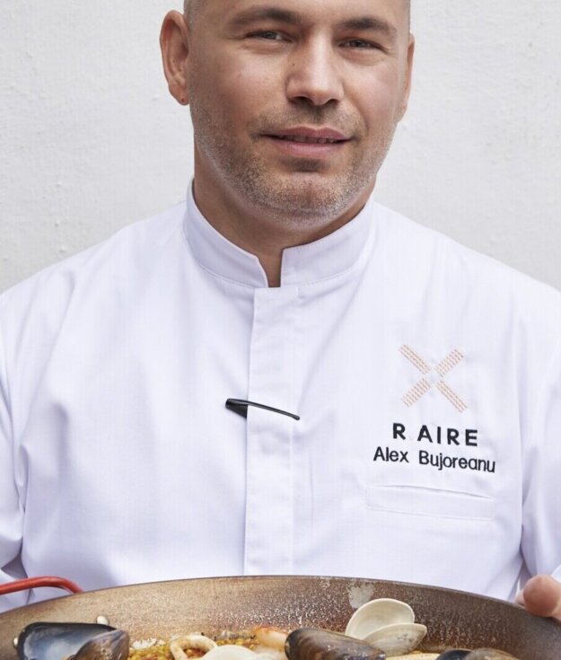 R.AIRE Chef Alex Bujoreanu with paella a plenty