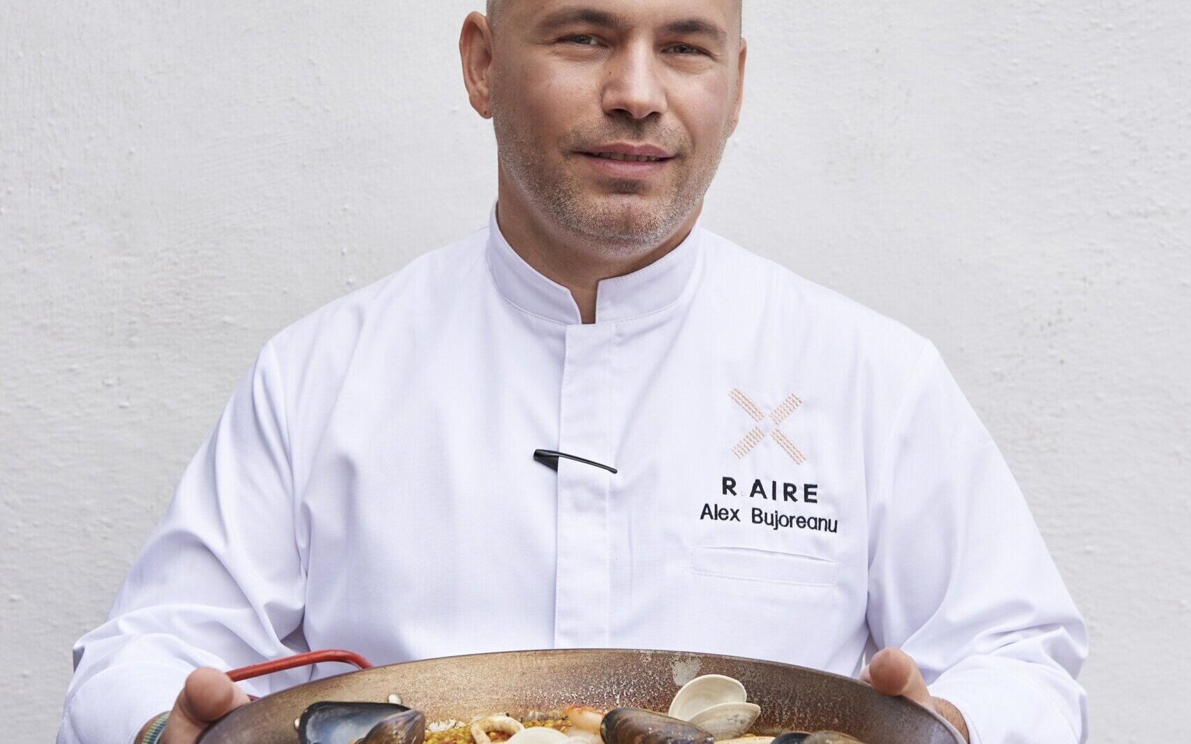 R.AIRE Chef Alex Bujoreanu with paella a plenty