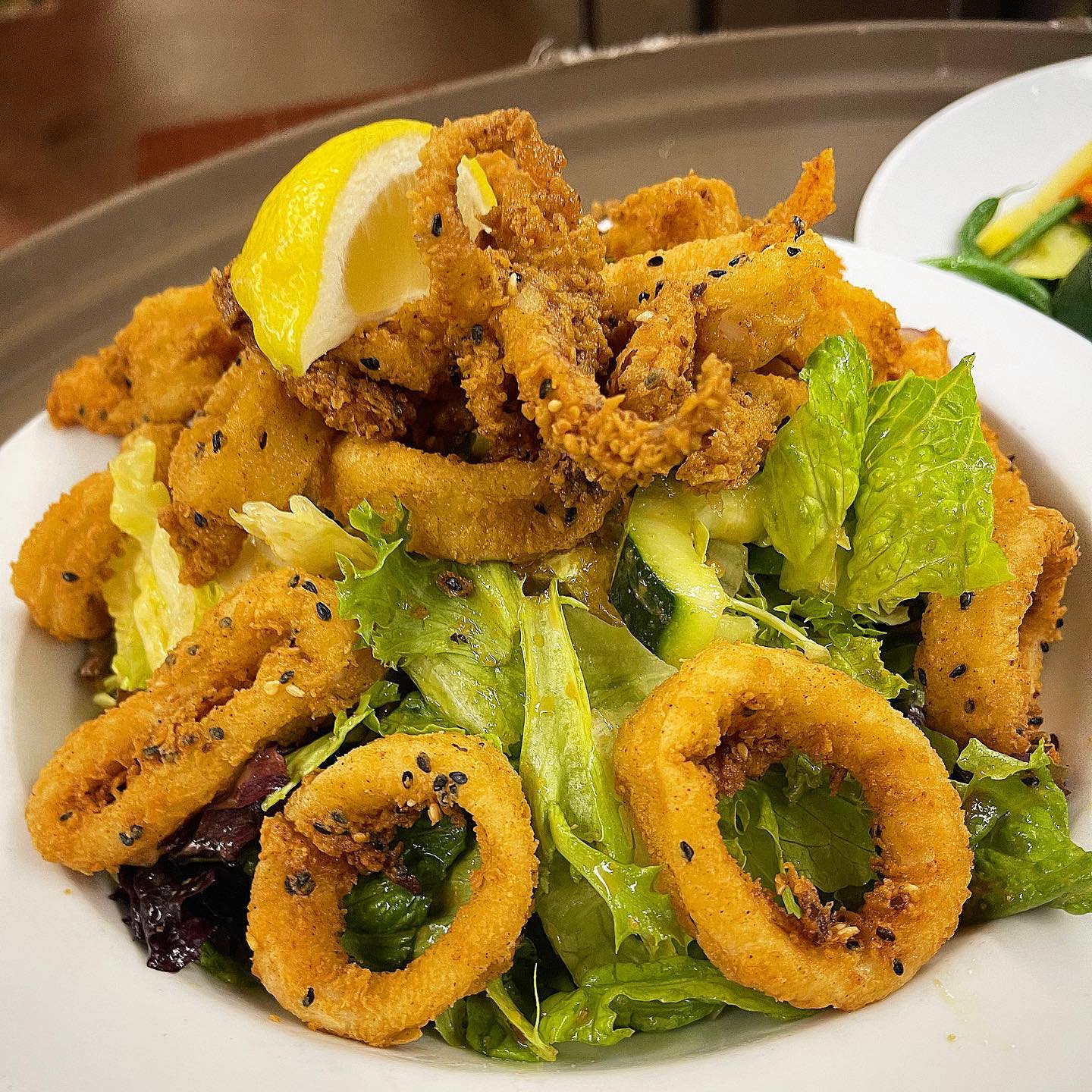 Cooperage Inn's Sesame Crusted Calamari Salad with mixed greens