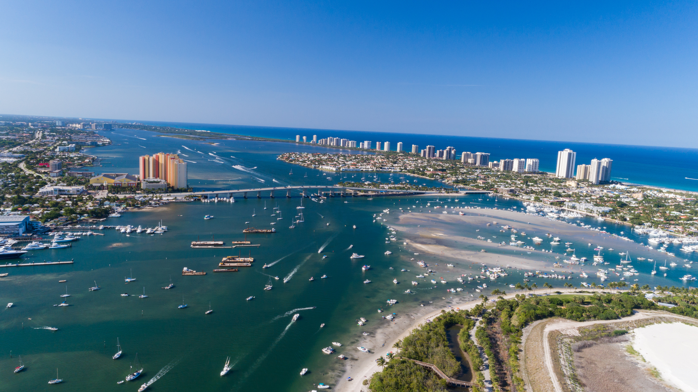 Aerial view of Peanut Island in Riviera Beach, Florida on memorial day weekend. Clear skies and blue water with plenty of boaters palm beach