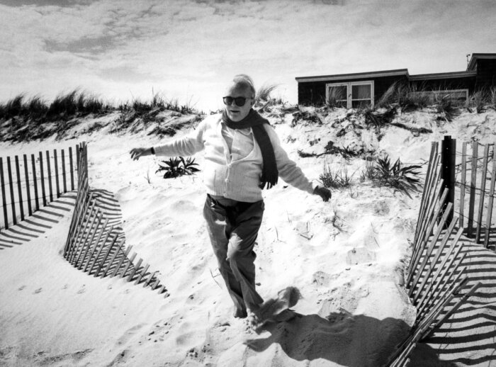 Truman Capote in Sand, 1982, by Harry Benson