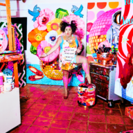 Ashley Longshore with several of her paintings