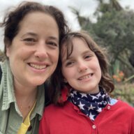 Abby Russell of Sticks and Stones comedy with her daughter, Aria