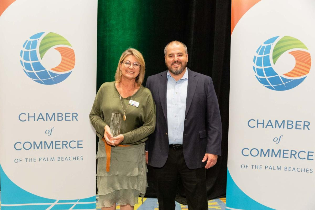 Julie Seaver of Compass Community Center accepting the Chamber of Commerce of the Palm Beaches Non-Profit of the Year Award on May 21, 2023.