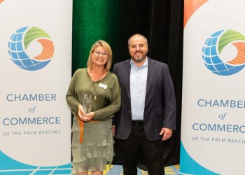 Julie Seaver of Compass Community Center accepting the Chamber of Commerce of the Palm Beaches Non-Profit of the Year Award on May 21, 2023.