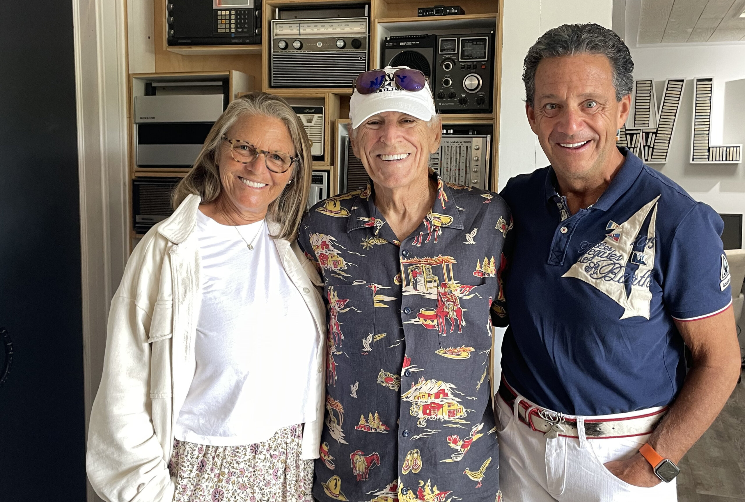 Jimmy Buffett with "Lunch on Deck" hosts Jessica Ambrose and Bill Evans at WLNG