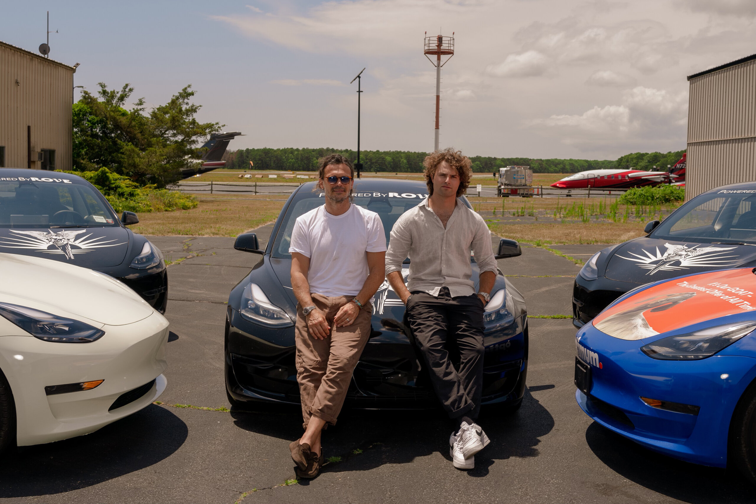 Rove owners Jack Brinkley Cook and Gianpaolo de Felice with their Rove Teslas