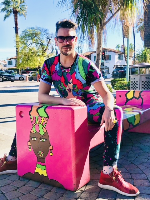 Dylan Smith sitting on "Dame Judy Bench"