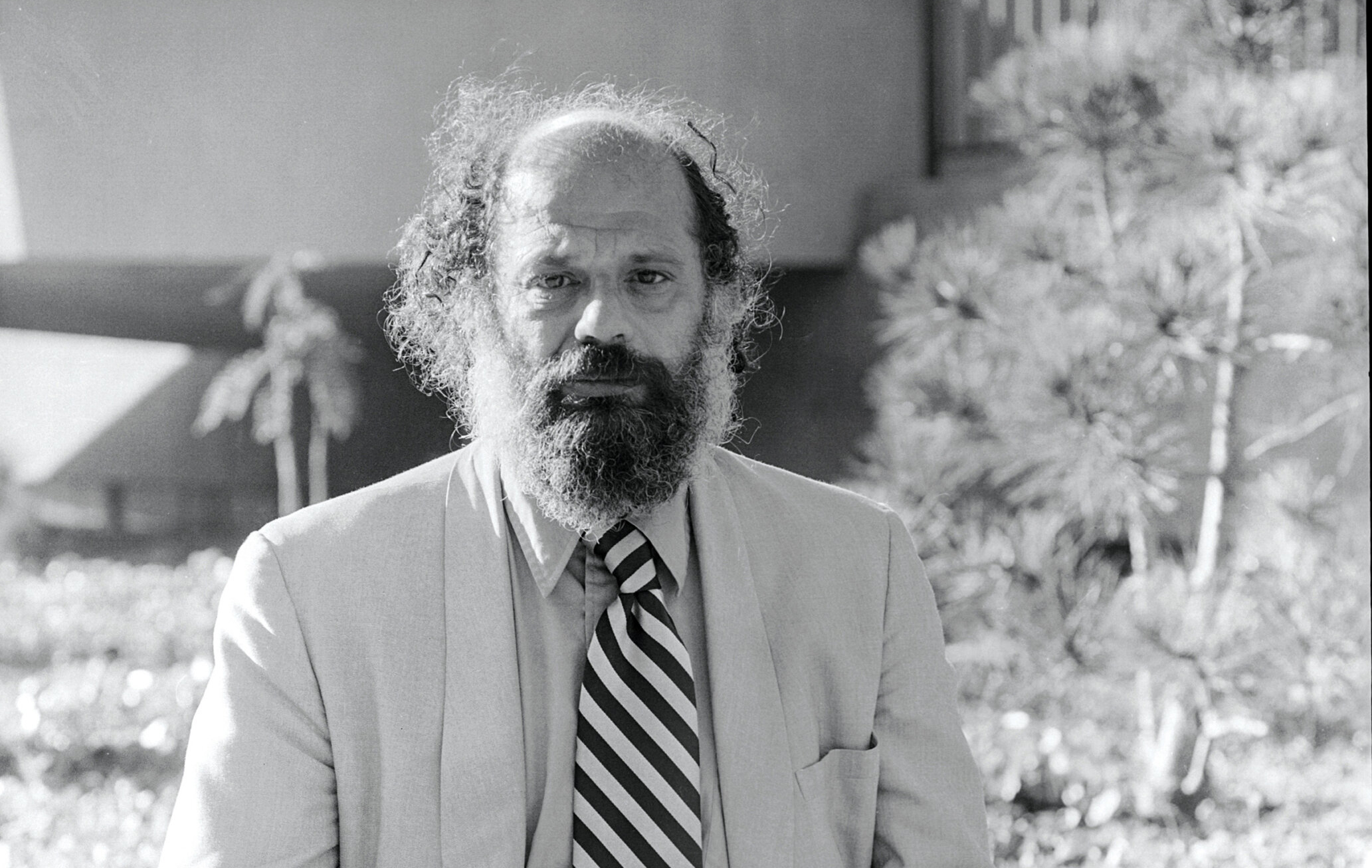 Allen Ginsberg on the grounds of the San Francisco Poetry Center, 1979, Photo: ©Joey Tranchina (cropped)