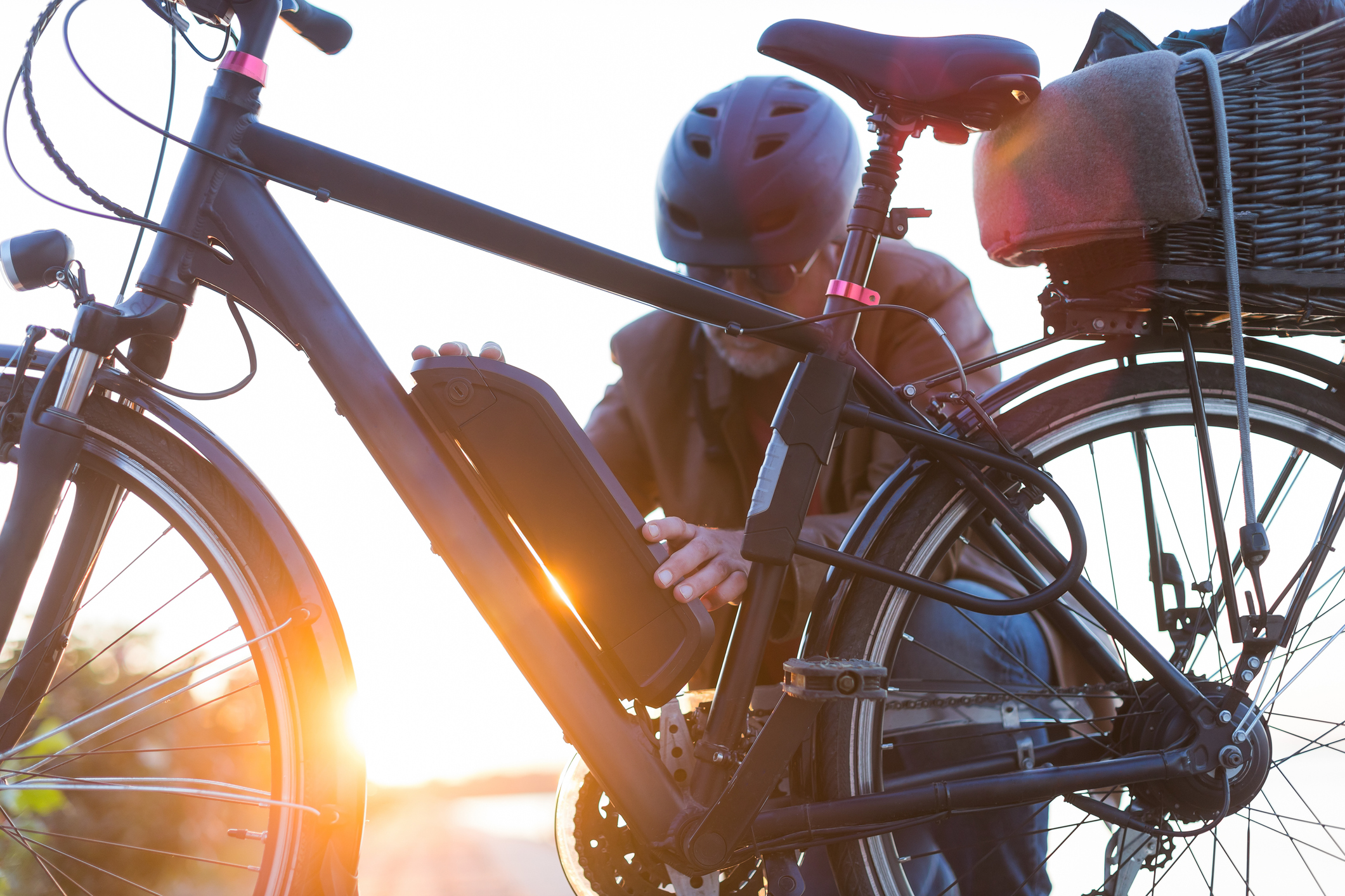 Biker inserting electric bike battery