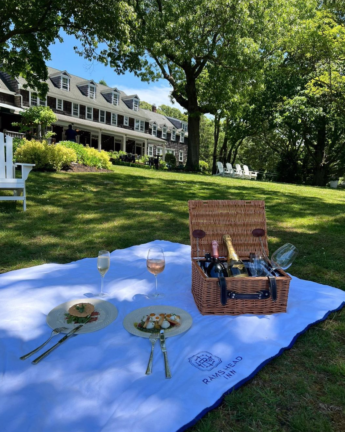 A picnic basket available for weekly picnics on the lawn at The Ram's Head Inn. 