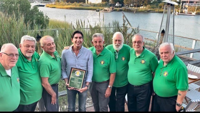 Harley Lippman (center) with the veterans he supports