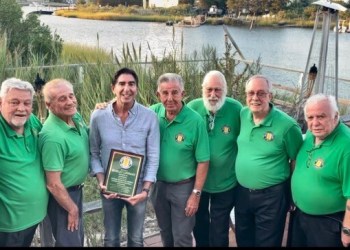 Harley Lippman (center) with the veterans he supports