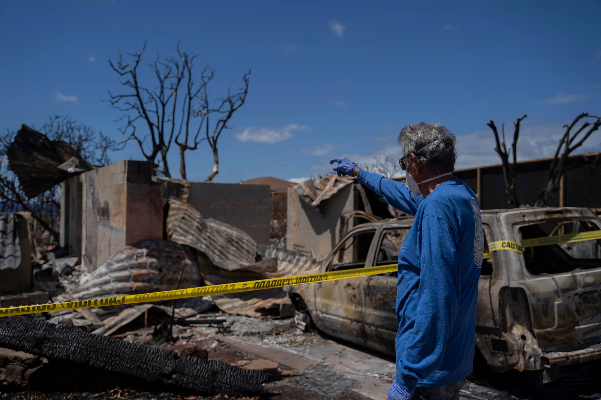 A Lahaina resident looks at his house for the first time after the wildfire in August, on September 26, 2023. Maui Photo: AP Photo/Mengshin Lin
