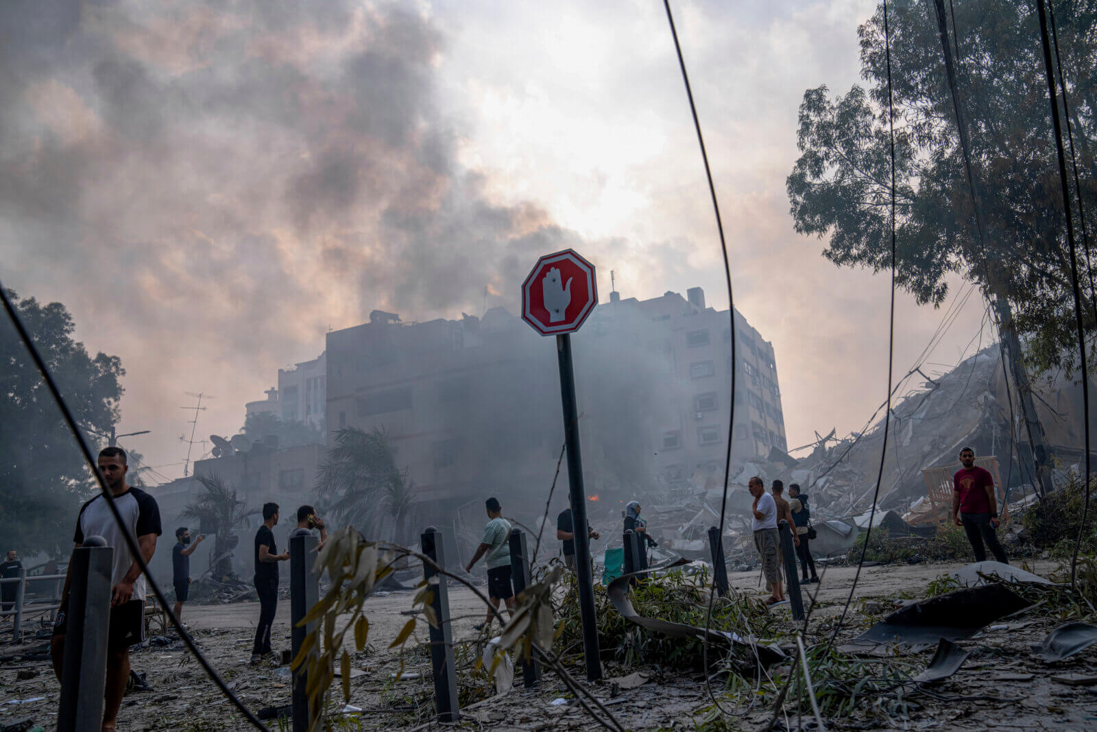 Palestinians inspect the rubble of a building after it was struck by an Israeli airstrike in Gaza City on Sunday, Oct. 8. in IsrealAP Photo/Fatima Shbair