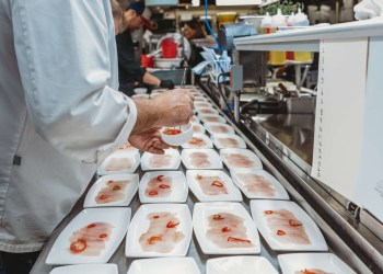 A chef from Nick & Toni's preparing the Feast of the Seven Fishes