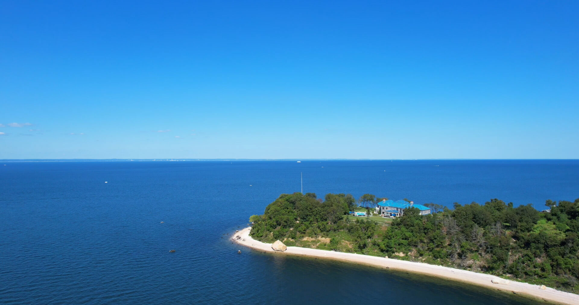 A home with 20,000 square feet of living space sits on a 10-acre peninsula on Crane Neck Point in Old Field.