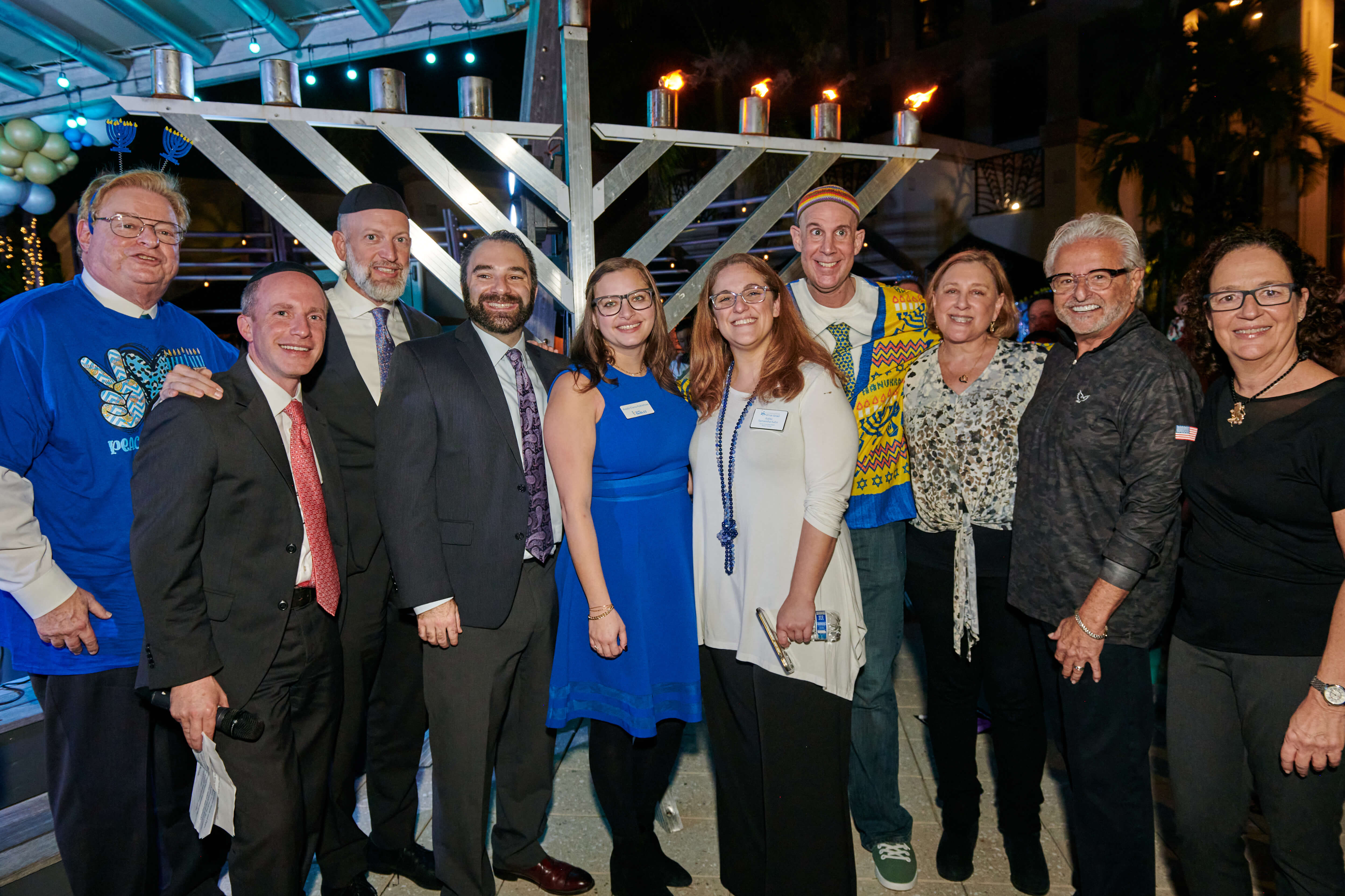 Rabbi Bert Kieffer, Rabbi Josh Broide, Rabbi Efrem Goldberg, Rabbi Greg Weisman, Rabbi Elana Rabishaw, Rabbi Samantha Kahn, Rabbi Rony Keller, Marla Weiss Egers, Larry Feldman, Dana Vizner at the Community-wide Chanukah Celebration in Boca, Courtesy PJ LIbrary