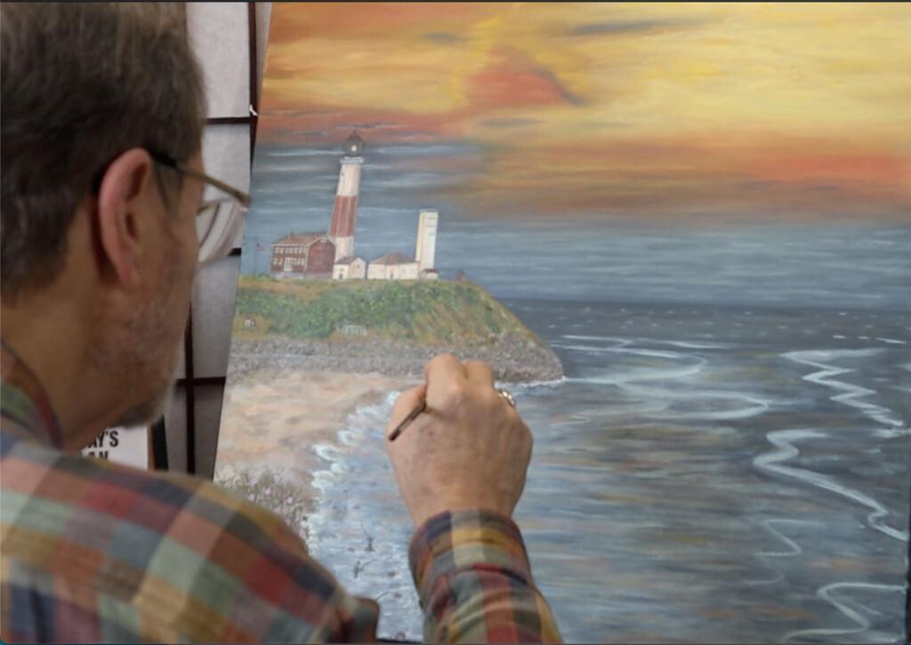 Vietnam veteran John Melillo painting his new Lighthouse for Hampton Fine Art Fair 2023
