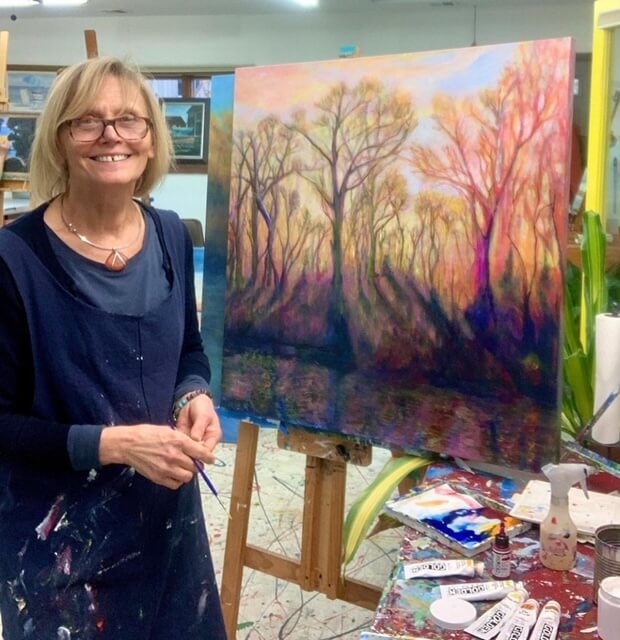 Diane Alec Smith with her "Sundown" painting