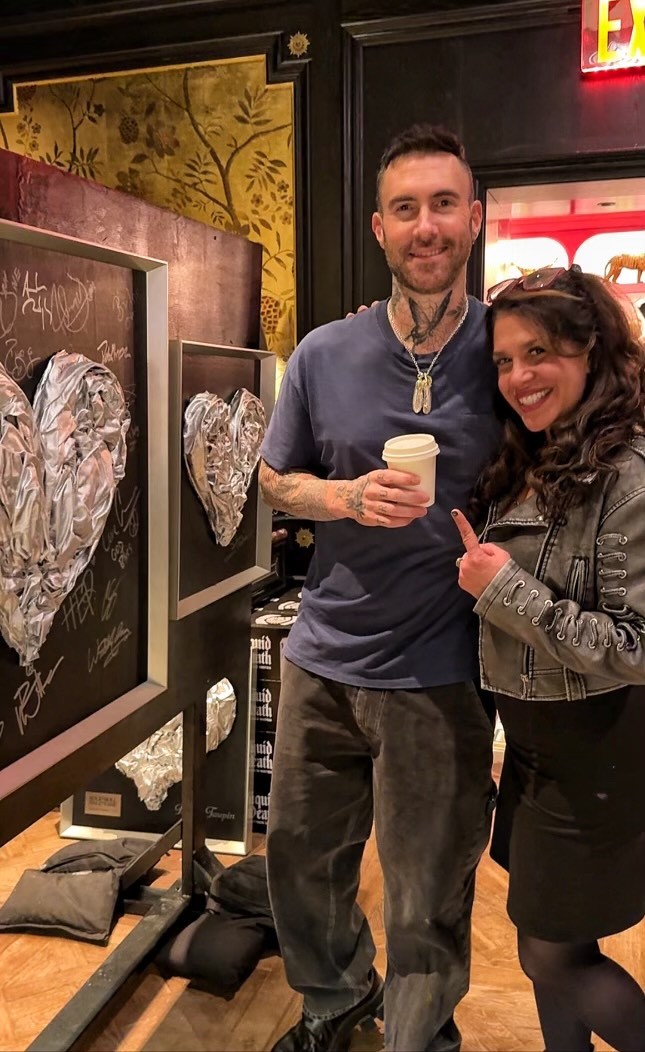 Adam Levine signing Jennifer Jo Contini's "Platinum Love"