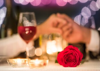 Couple holding hands, enjoy a romantic Valentine's meal on the North Fork