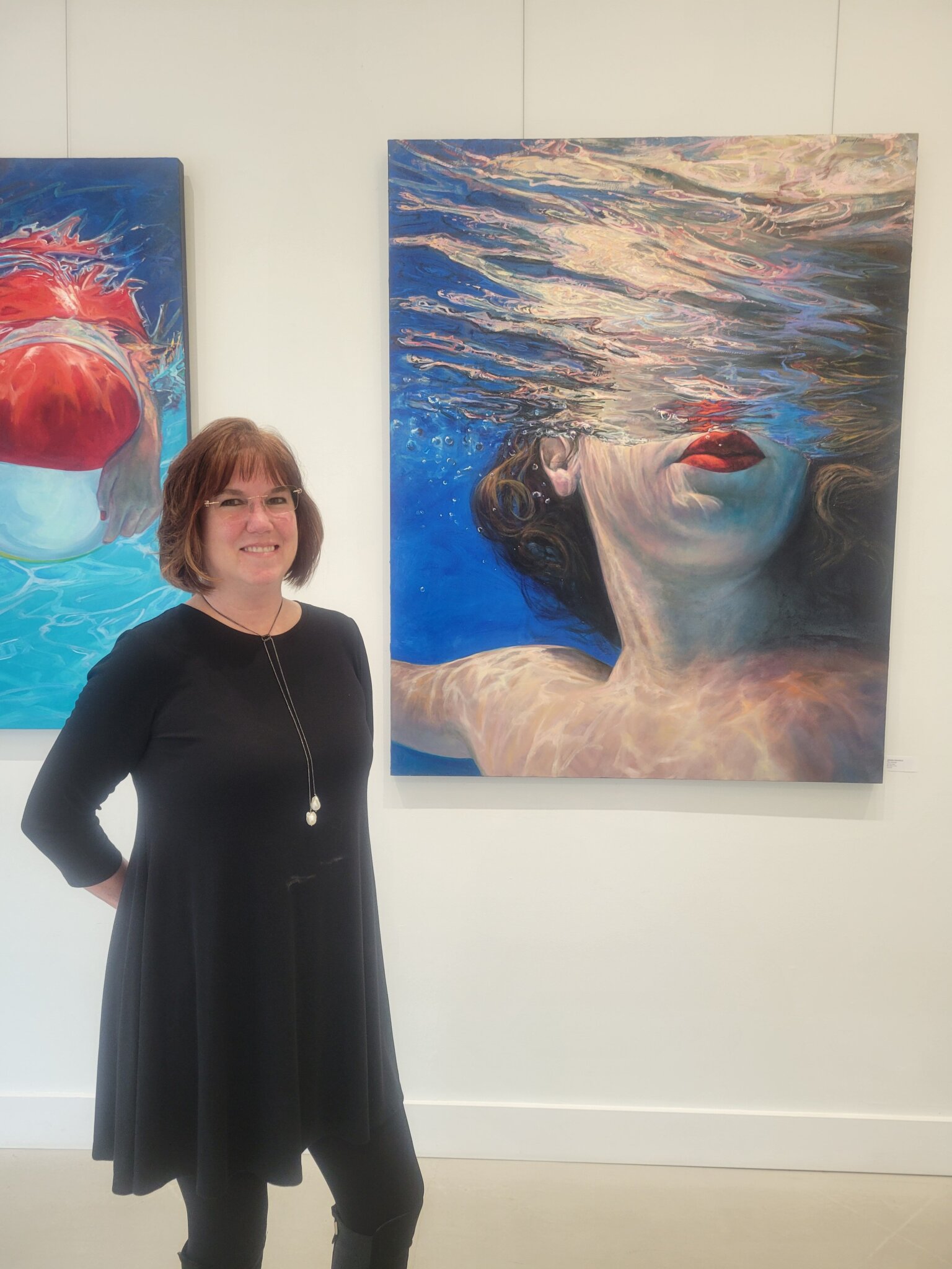 Eileen Baumeister McIntyre with “The Journey” by Jennifer Hannaford, featured on the July 21, 2023 Dan’s Papers cover and available at Art Studio Hamptons Gallery.