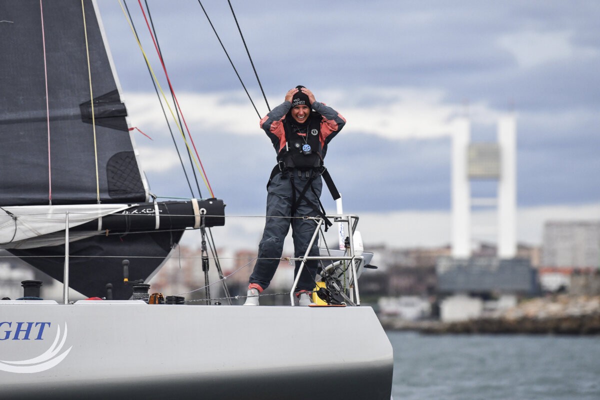 Cole Brauer aboard the First Light as she crossed the finish line in Spain