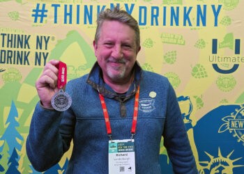 Richard Vandenburgh of Greenport Harbor Brewing Co. shows off their Silver medal at the New York State Craft Beer Competition