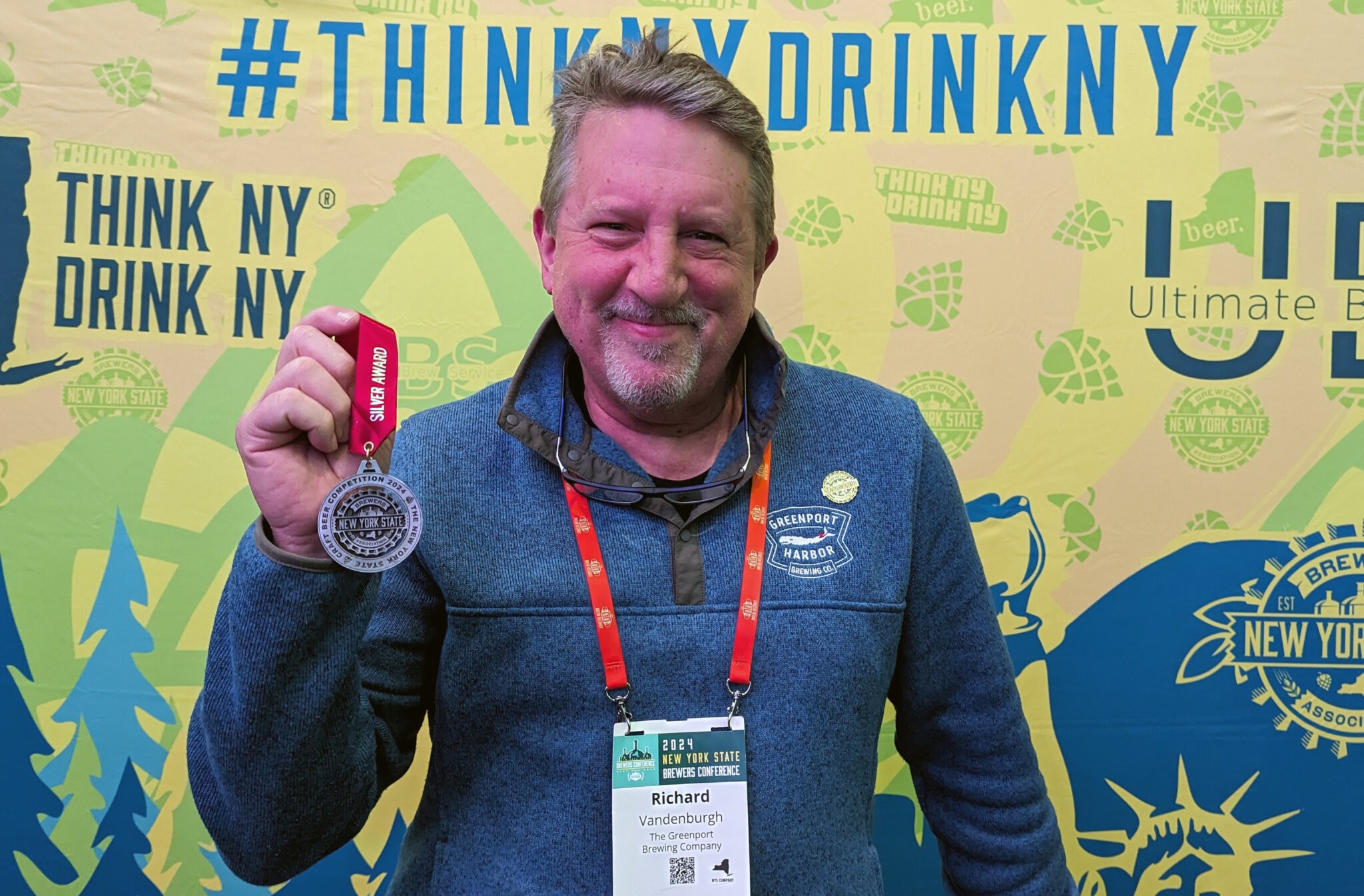 Richard Vandenburgh of Greenport Harbor Brewing Co. shows off their Silver medal at the New York State Craft Beer Competition