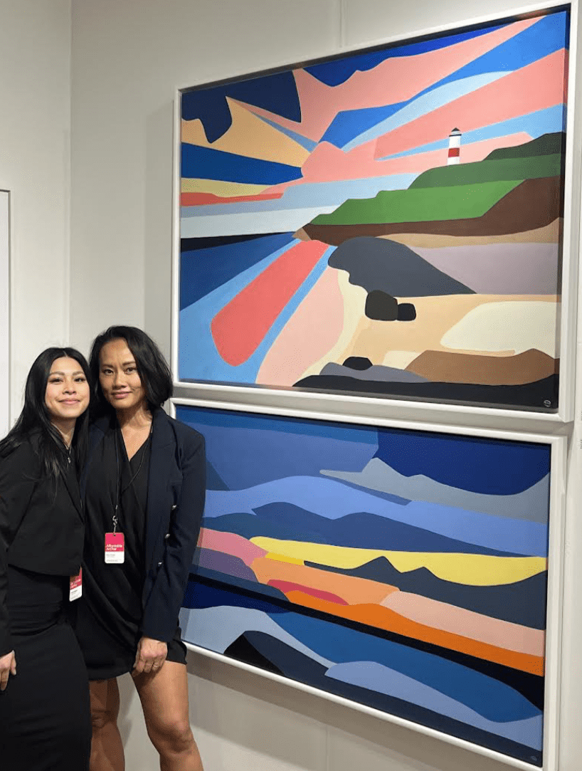 Denise Nguyen and Mary Nguyen with their TMU paintings "Montauk Glow" and "Dreamscapes"