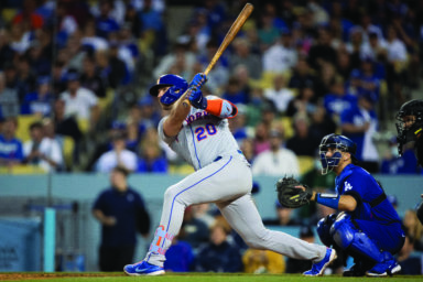 New York Mets' Pete Alonso, left, watches his two-run home run in Los Angeles on Saturday, June 4, 2022